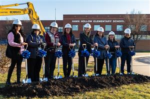 Dr. Johnson and Board Members pose for ceremonial groundbreaking photo